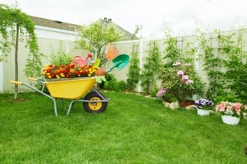 Local gardening team caring for shrubs and lawn areas in Little Ilford