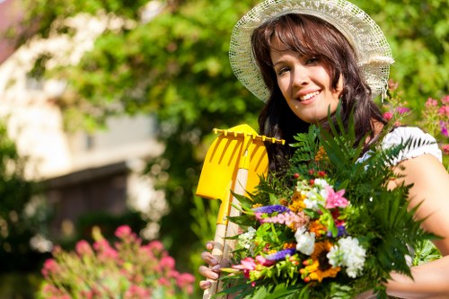 Soft landscaping with shrubs, lawn, and layered planting in Little Ilford