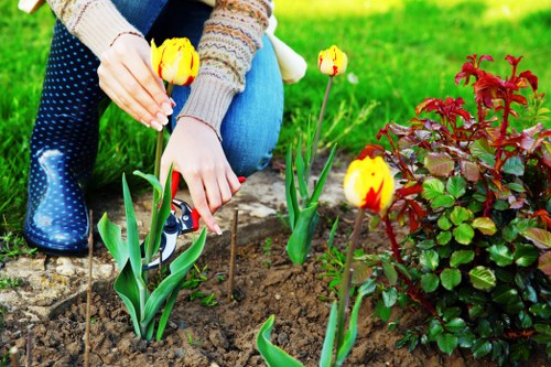 Professional gardeners applying health and safety procedures